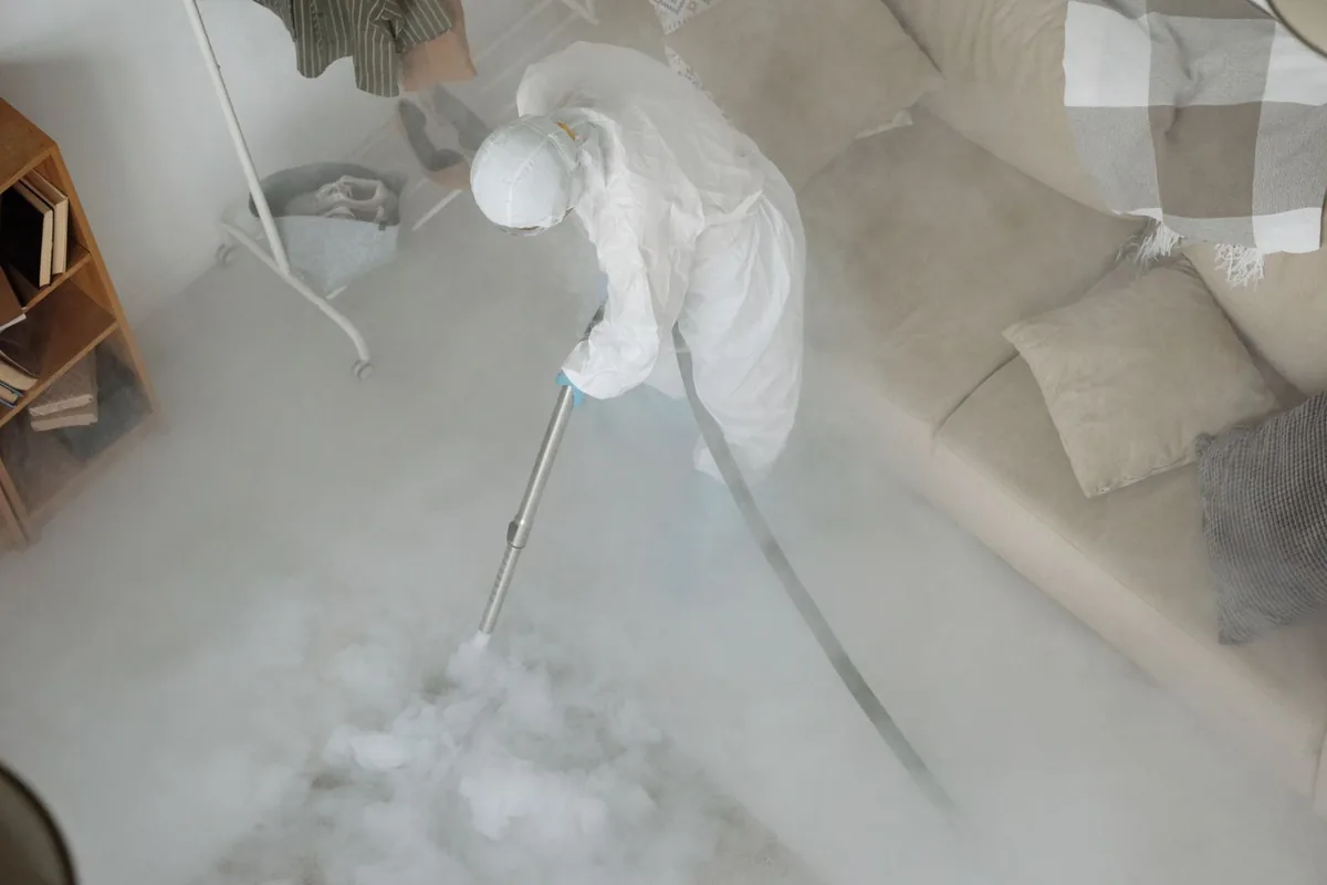 Biohazard cleanup technician in protective equipment, Stevens Point, WI